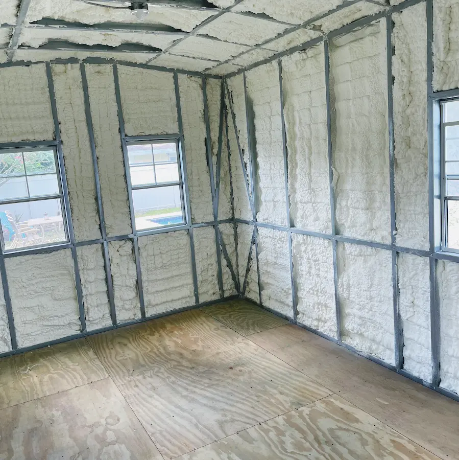 Closed-cell spray foam insulation applied to wall cavities in a residential project in Goddard